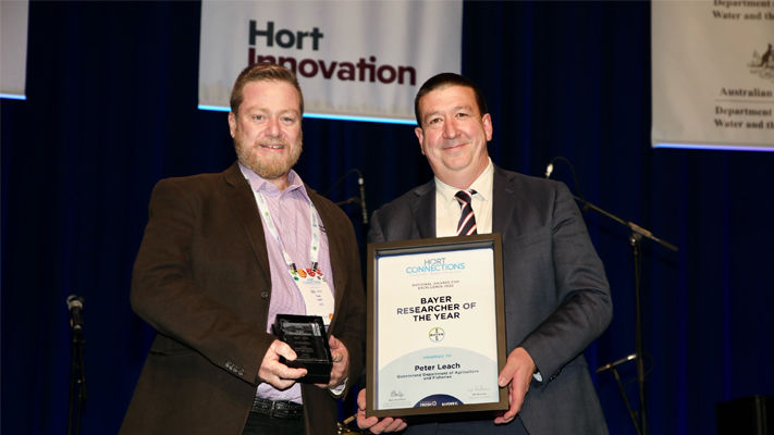 Tony May presents Peter Leach with Bayer Researcher of the Year award