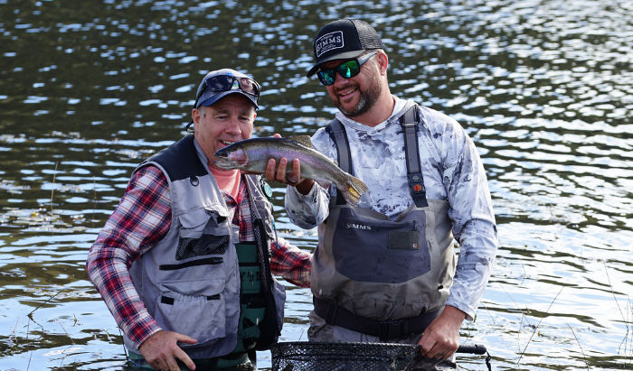 Bayer Crop Science Managing Director, Warren Inwood, says the company is proud to support rural mental health. Warren is pictured with Matt Tripet, of The Fly Program, holding his catch.