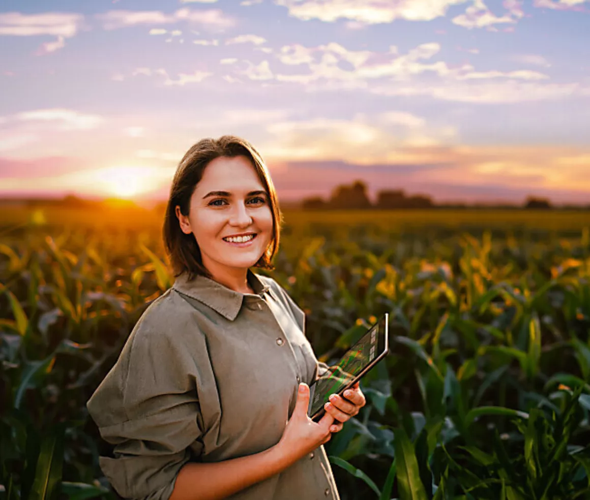 Smiling Farmer Hugging A Dog