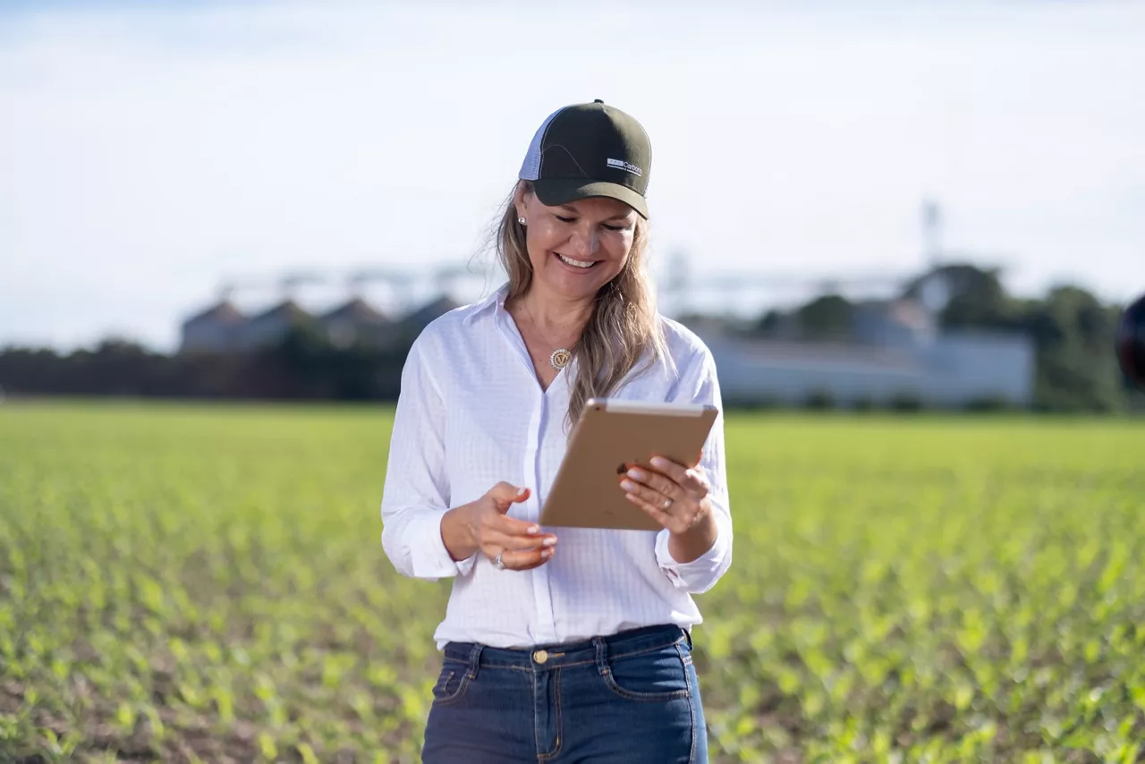 Farmer in field with an iPad