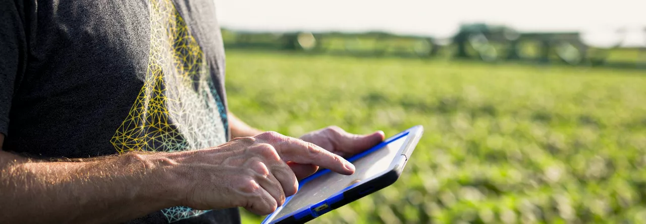 Farmer using iPad in Field