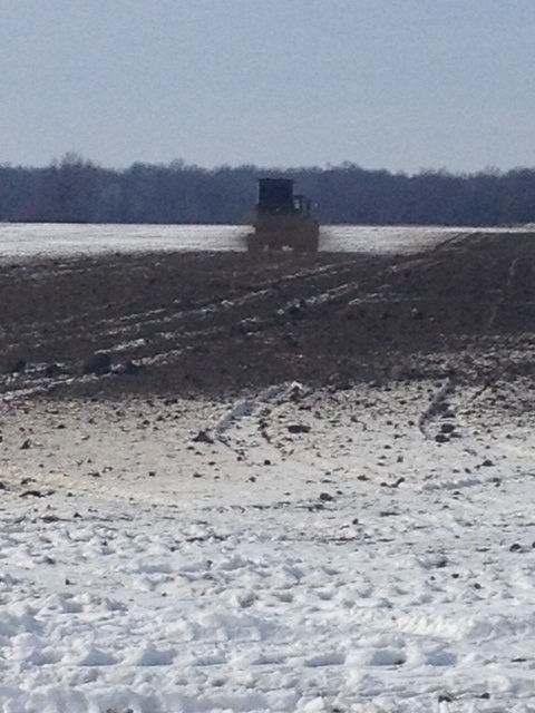 Wintertime broadcast manure application on a field 