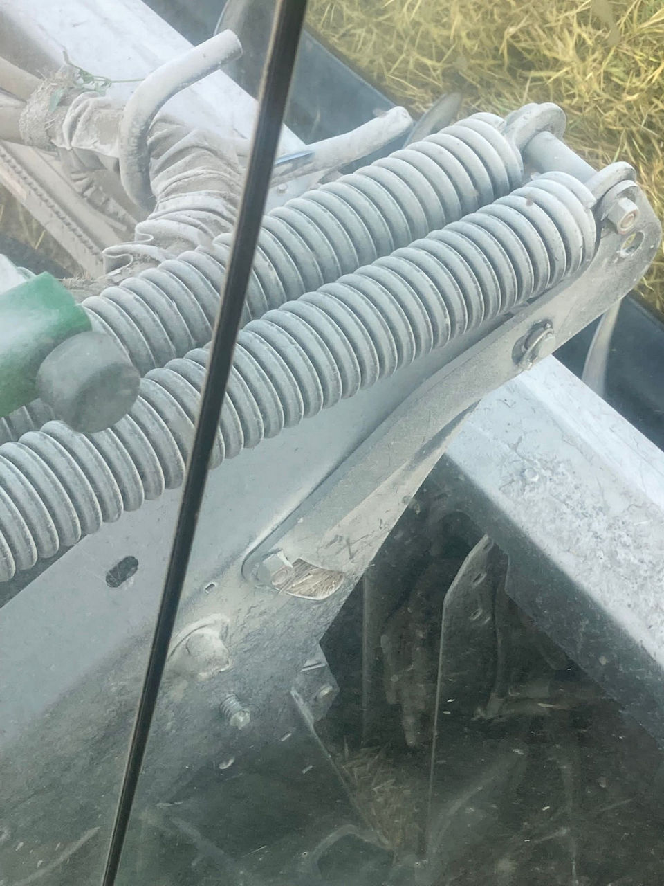 Figure 12. White dust from a powdery mildew infected canola crop settling on harvest equipment. 