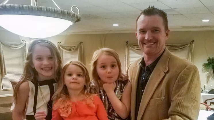 Marcus Hess and his daughters.