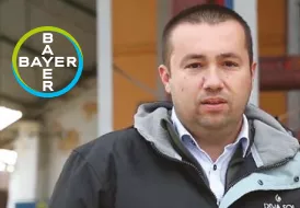 a farmer with the Bayer logo