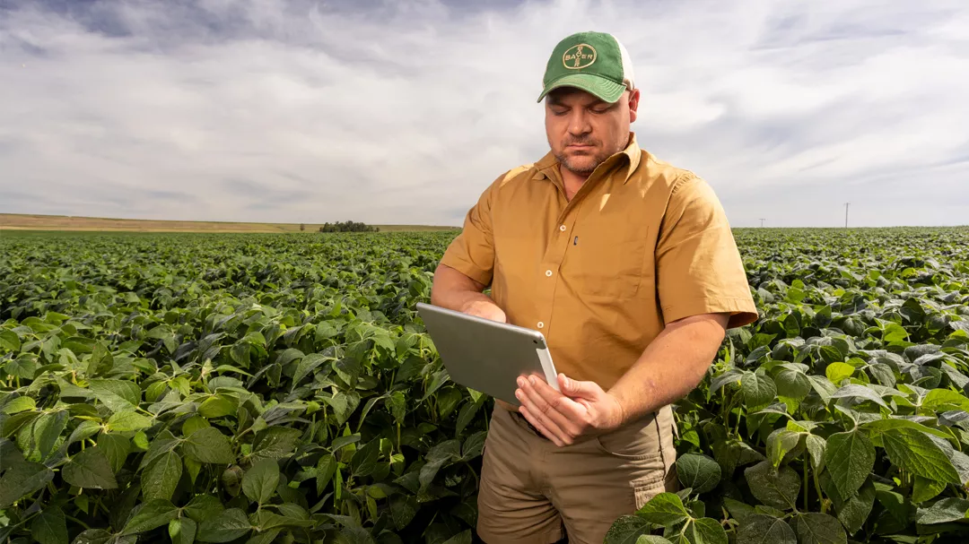 Farmer in field with an iPad