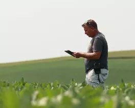 Farmer with iPad in Field