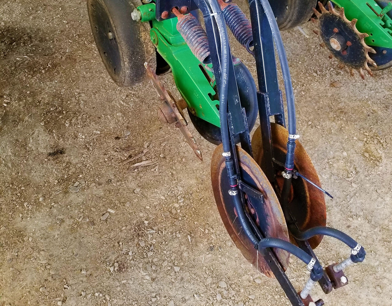 Figure 2. Starter fertilizer application system on row planter. Image courtesy of Dan Quinn, Purdue University.