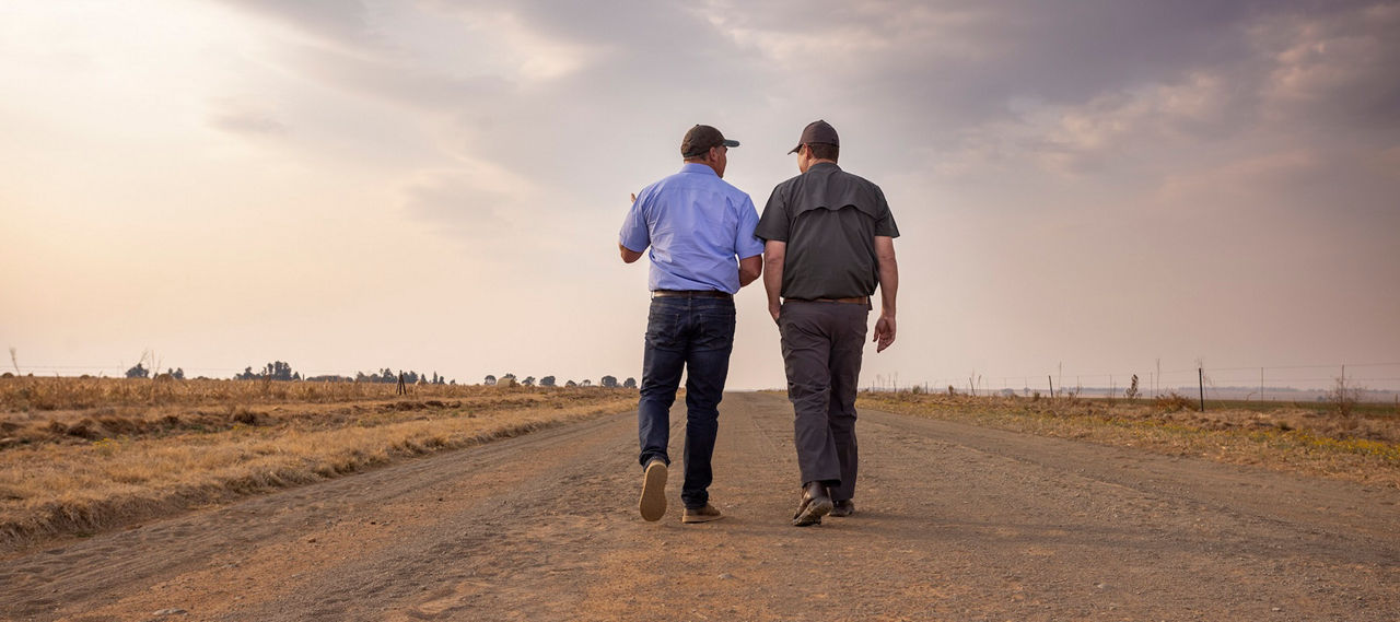 Two farmers walking