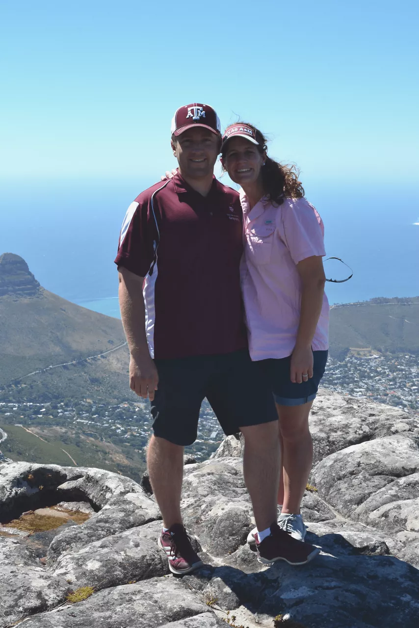 Rosie and Cameron atop a mountain