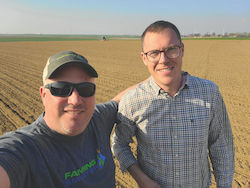 Ken Coles and Charles Lecournet standing in a field