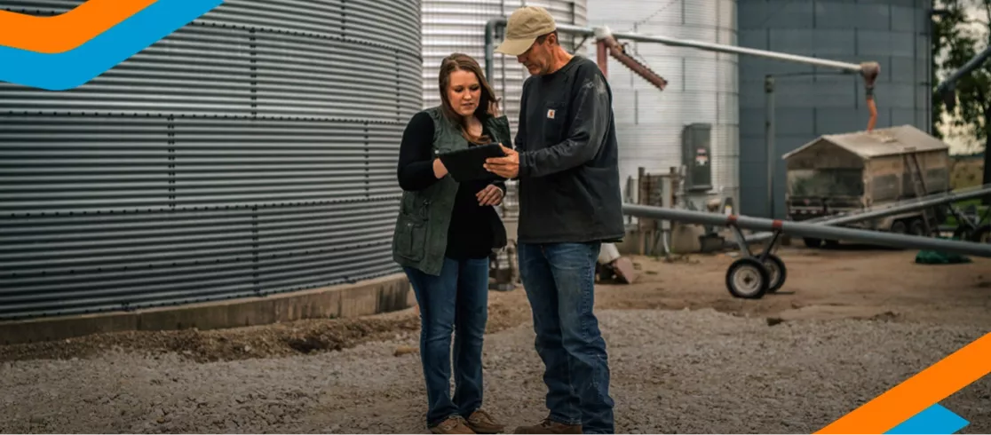 Farmer and Agronomist Reviewing Data on iPad