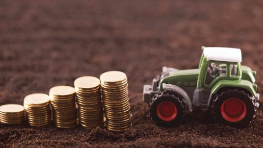 Toy tractor pulling coins