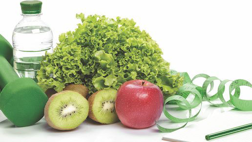 Flat lay photo of an assortment of fruit, vegetables, a water bottle, and hand weights